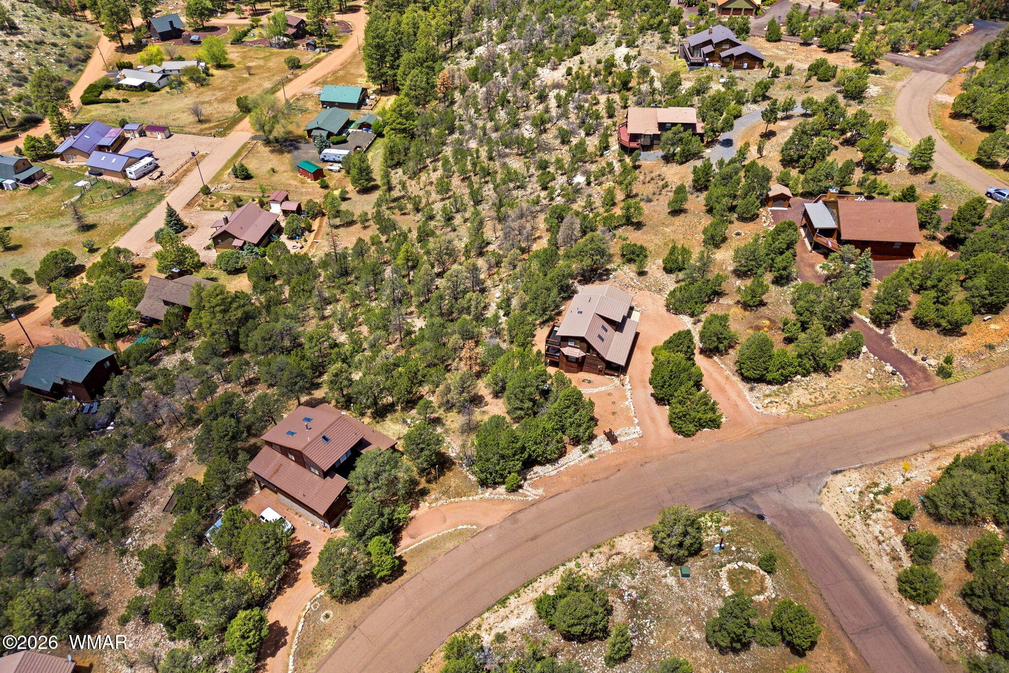2806 Sky Hawk Drive Overgaard, AZ 85933 - Photo 39 of 43 an aerial view of a house with a yard and trees
