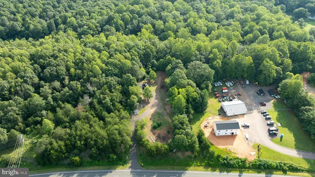 an aerial view of a house with yard