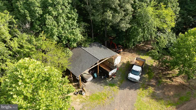 a view of a house with backyard space and sitting area