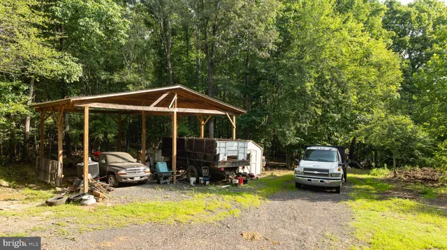 a view of a house with a tree