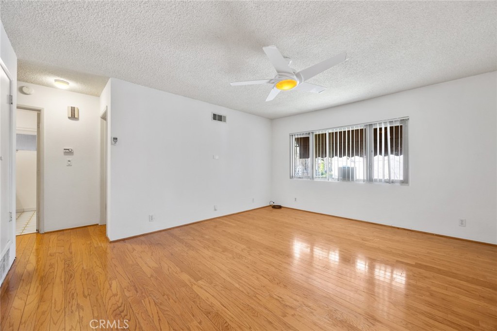 101 Hampden Terrace Alhambra, CA 91801 - Photo 11 of 46 a view of an empty room with wooden floor and a window