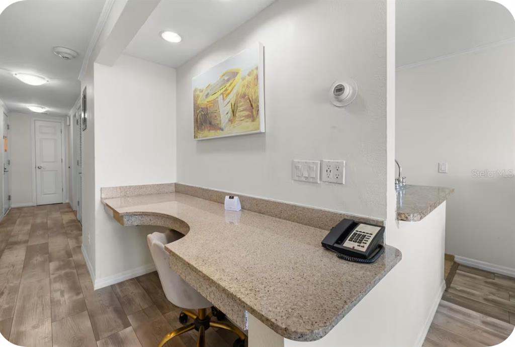 2506 North Rocky Point Drive, Unit 209 Tampa, FL 33607 - Photo 7 of 12 a living room with a couch and a table