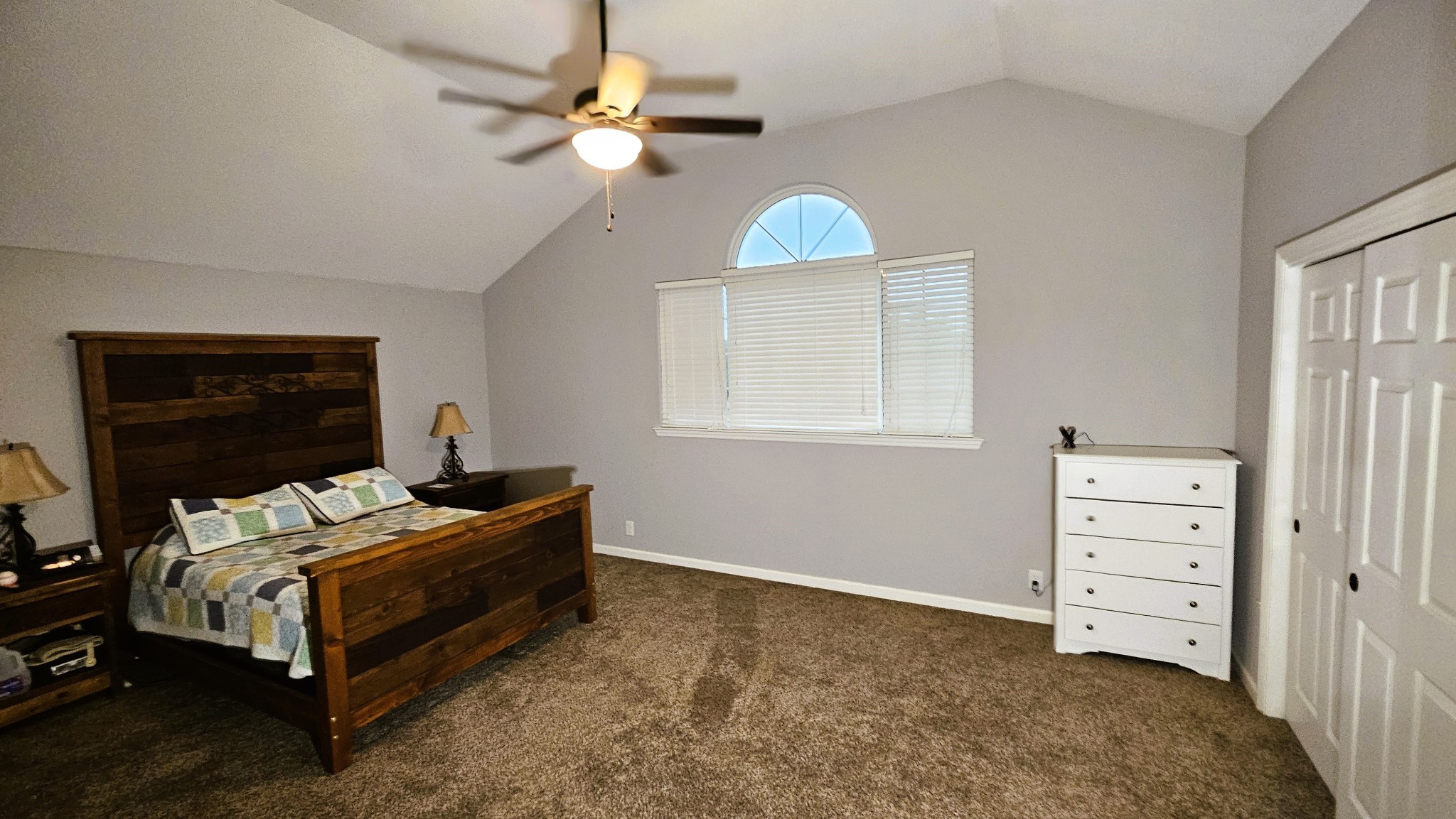 313 Lee Road Cottontown, TN 37048 - Photo 23 of 43 a bedroom with a bed and a chandelier