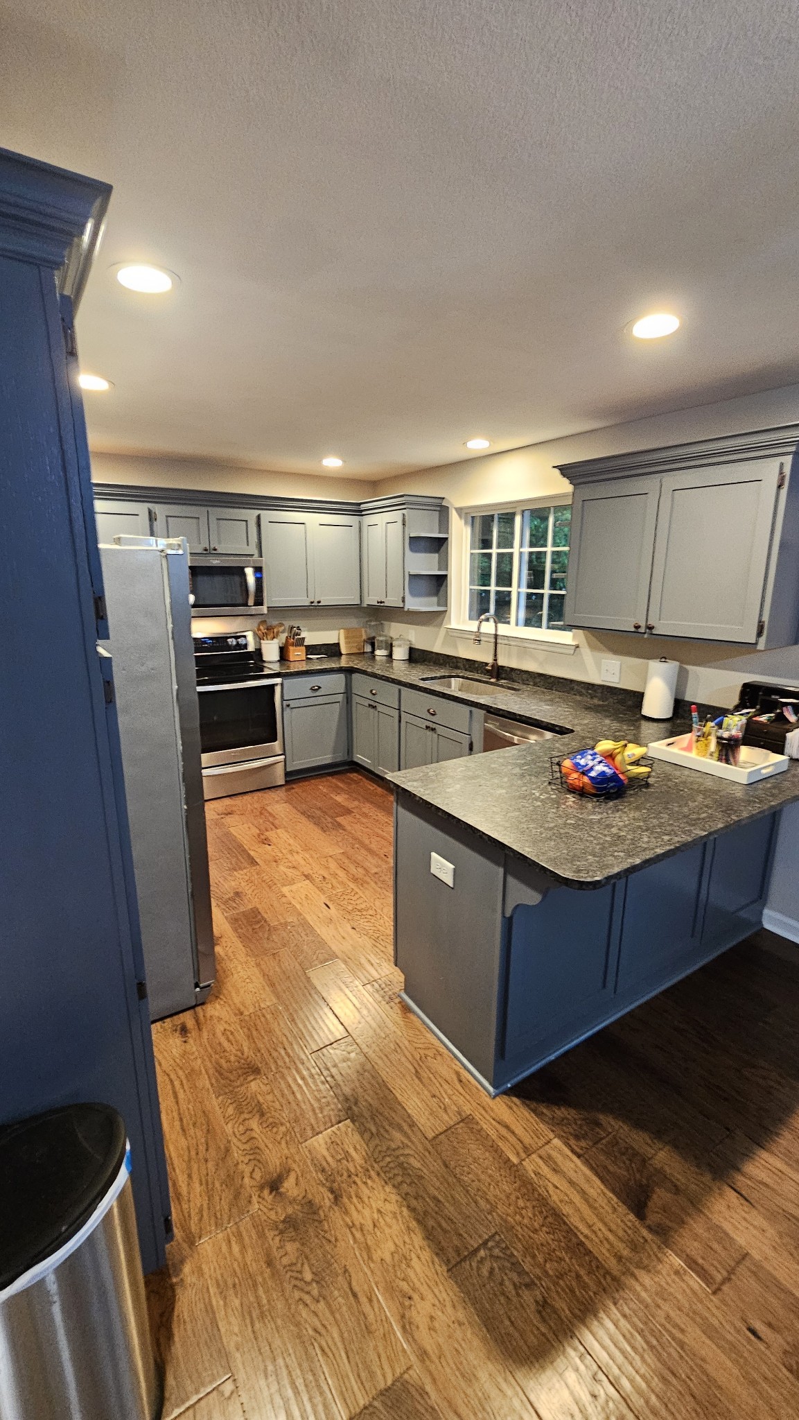 313 Lee Road Cottontown, TN 37048 - Photo 30 of 43 a kitchen with stainless steel appliances granite countertop a stove a sink and a refrigerator