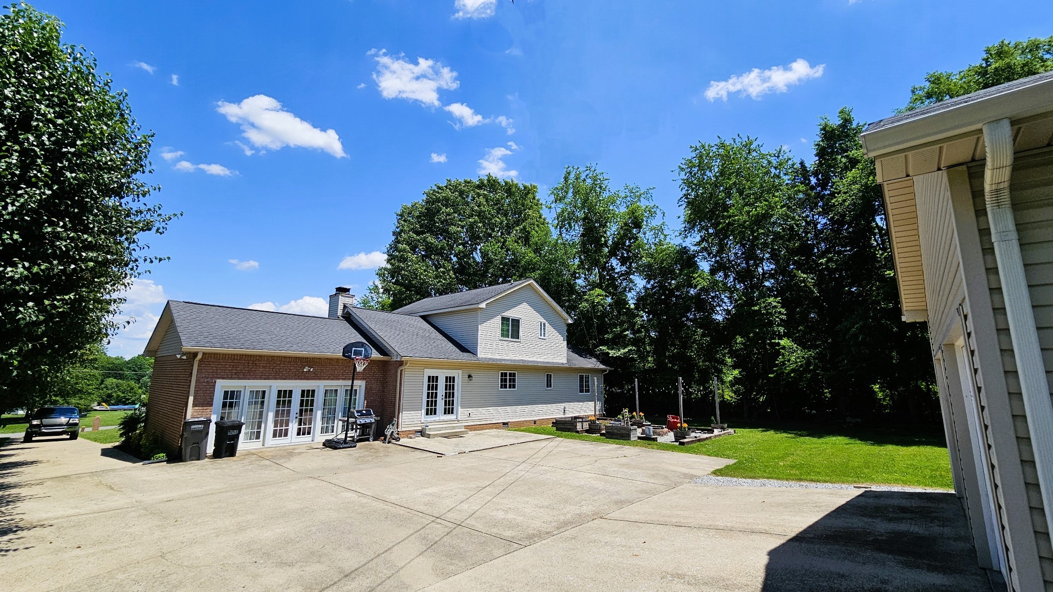 313 Lee Road Cottontown, TN 37048 - Photo 10 of 43 a front view of a house with a yard and garage