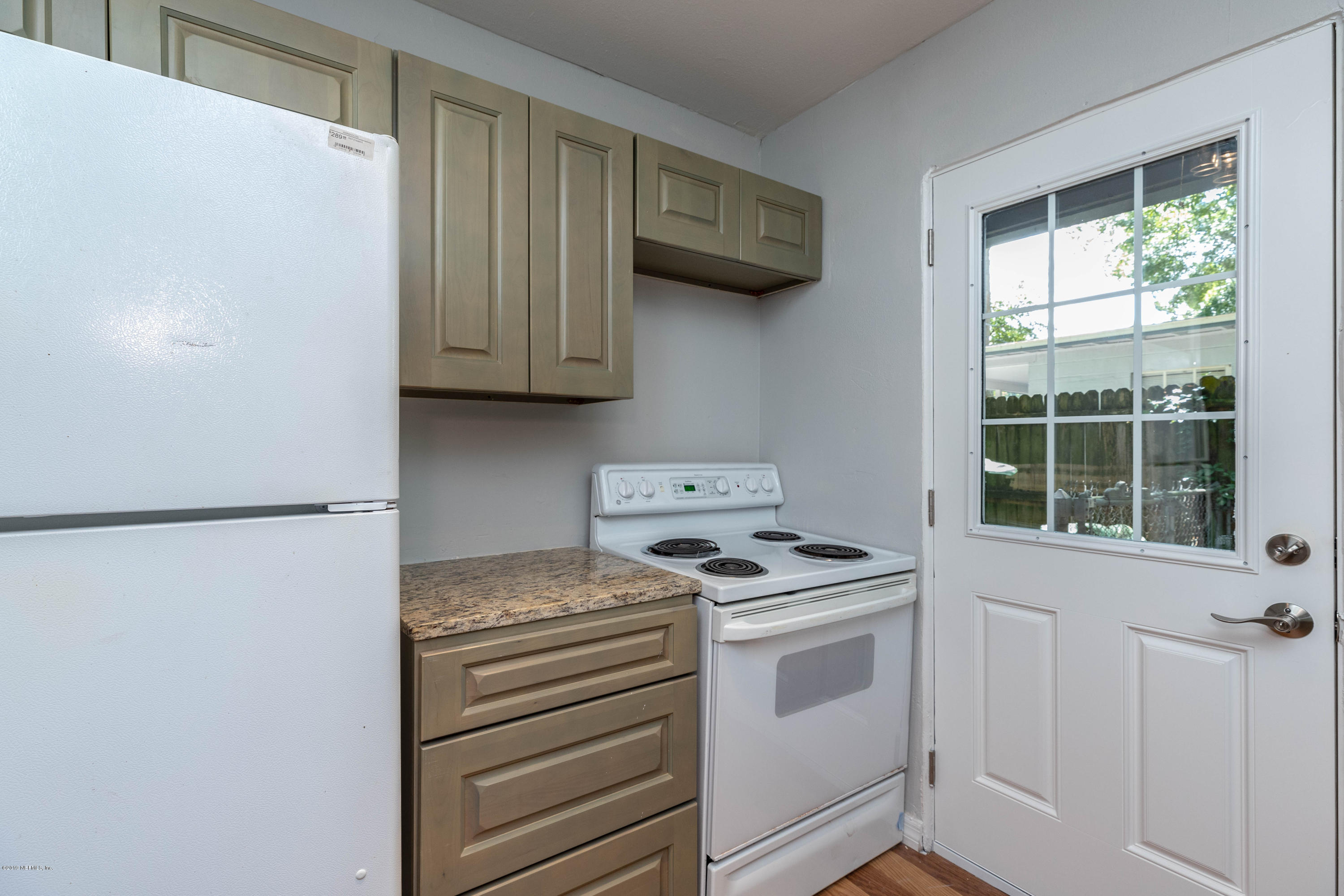 5318 South River Road Jacksonville, FL 32211 - Photo 12 of 32 a kitchen with a stove and a cabinet