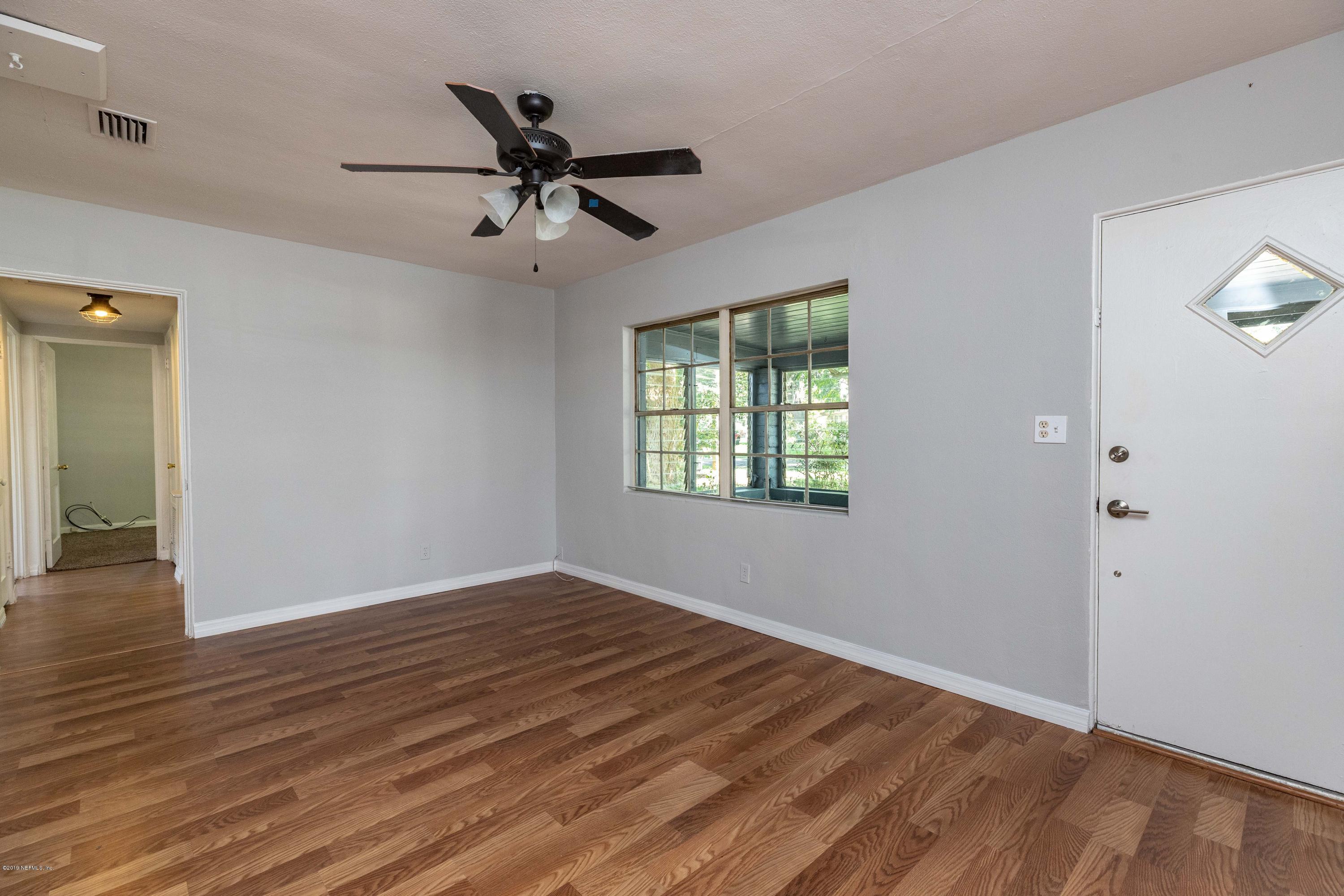 5318 South River Road Jacksonville, FL 32211 - Photo 25 of 32 wooden floor in an empty room with a window