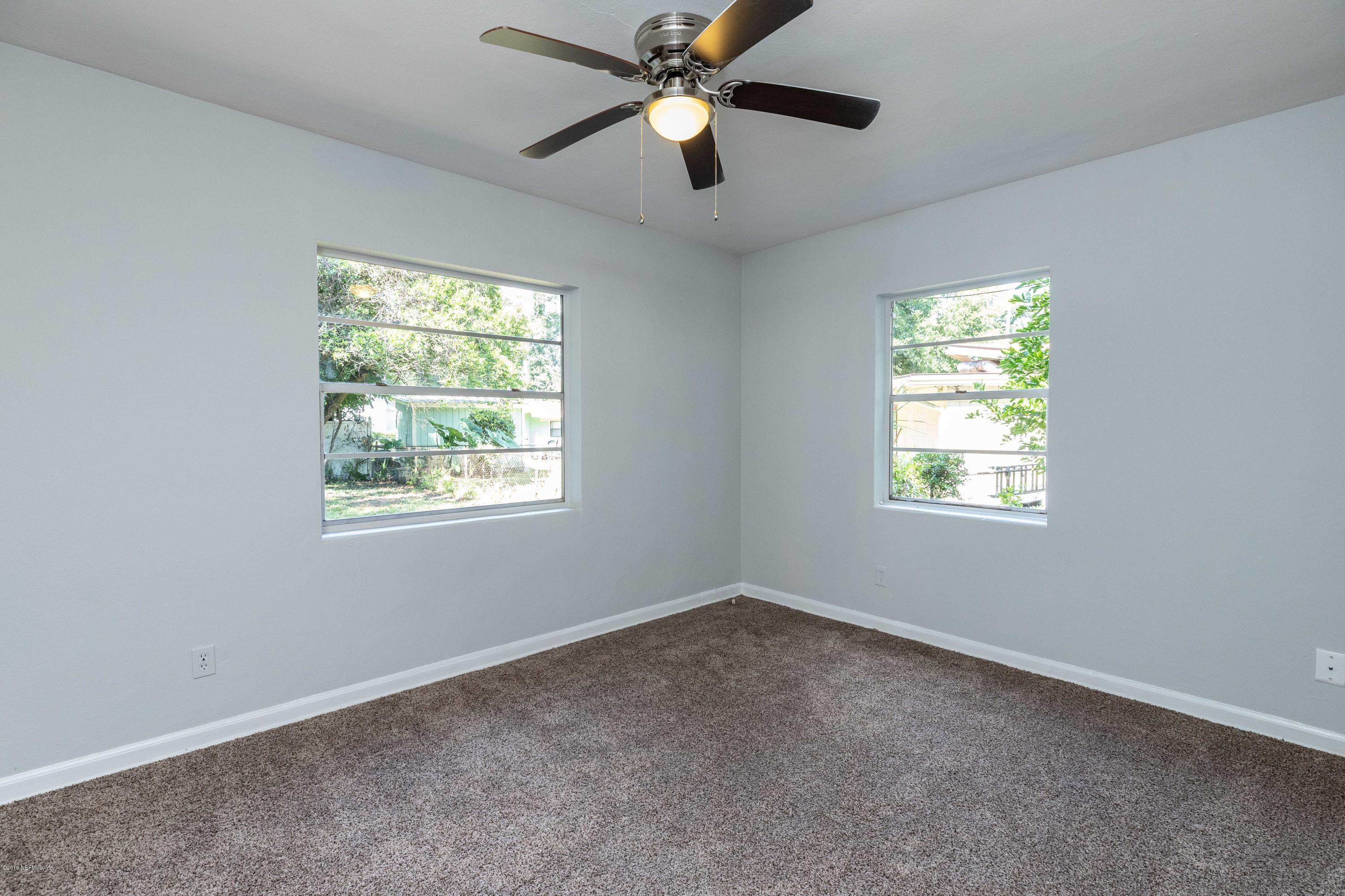 5318 South River Road Jacksonville, FL 32211 - Photo 28 of 32 an empty room with a window and a fan