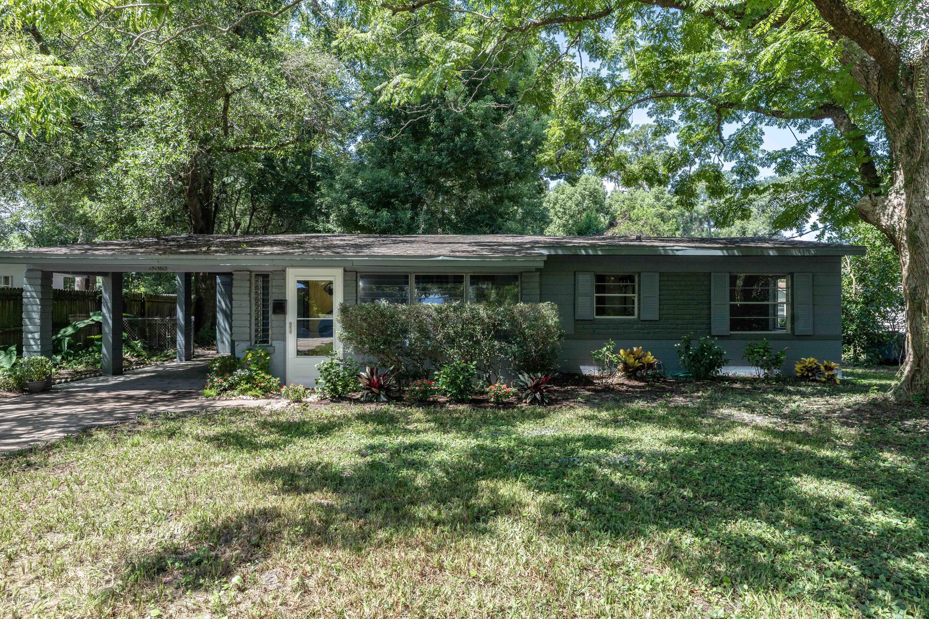 5318 South River Road Jacksonville, FL 32211 - Photo 4 of 32 a view of a house with a yard and plants