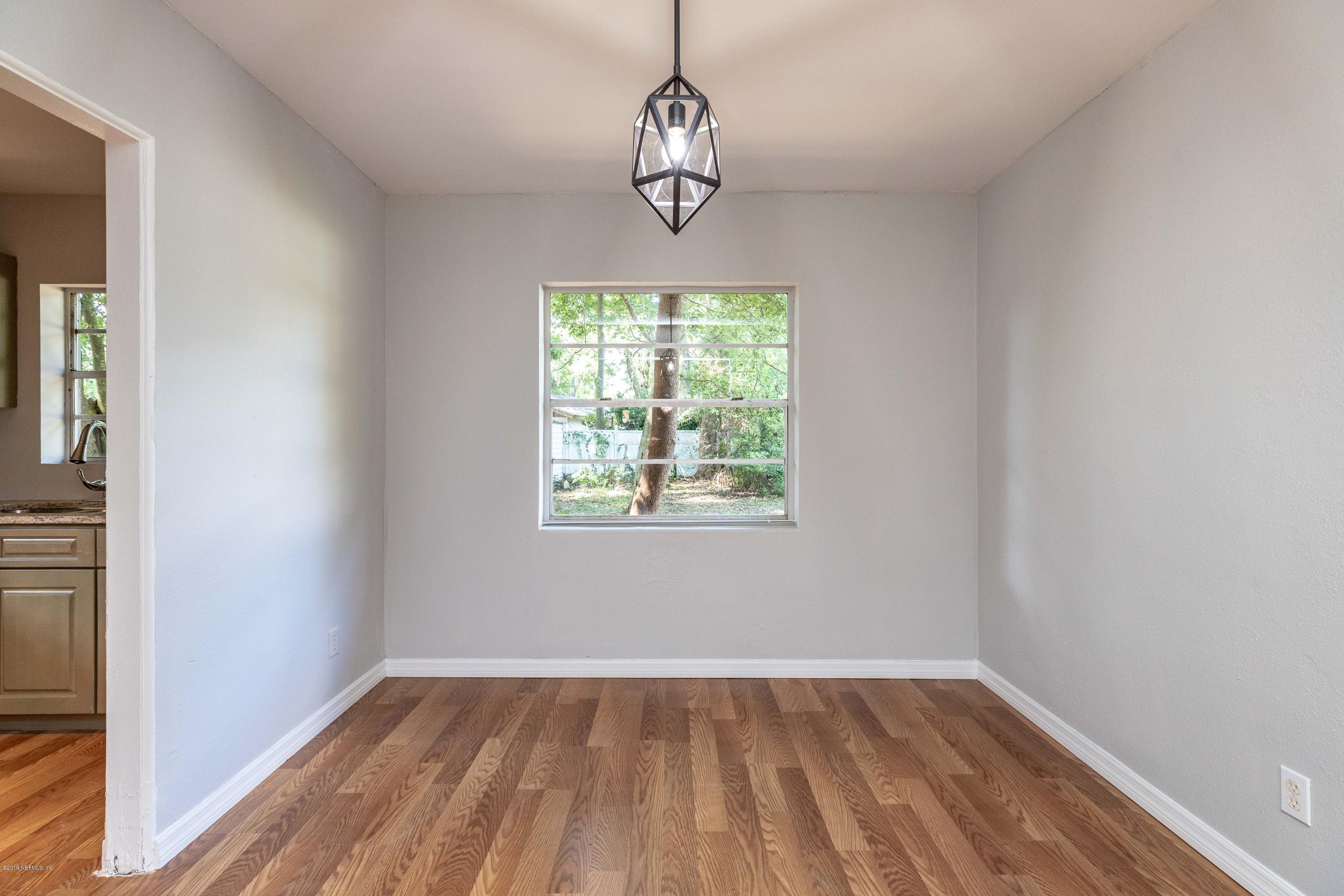 5318 South River Road Jacksonville, FL 32211 - Photo 5 of 32 a view of empty room with wooden floor and fan