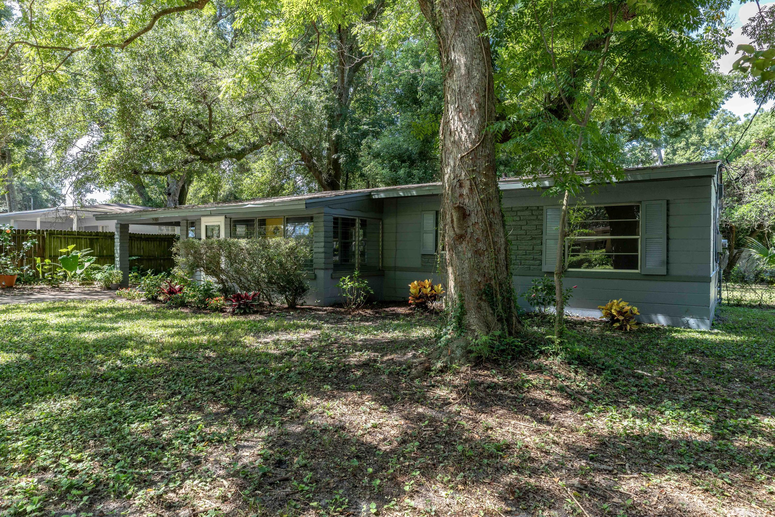 5318 South River Road Jacksonville, FL 32211 - Photo 10 of 32 a view of a house with yard and a garden