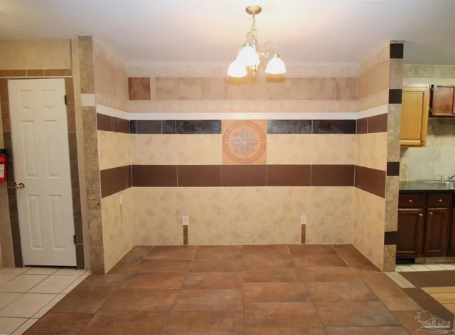 a view of a bathroom with a bathtub and a shower