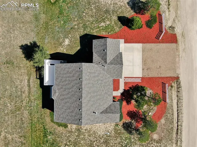 a view of a house with entrance gate
