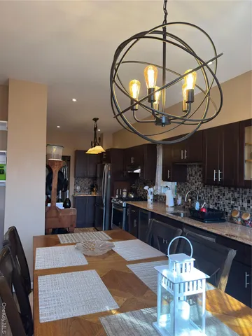 a room with lots of gym equipment and wooden floor