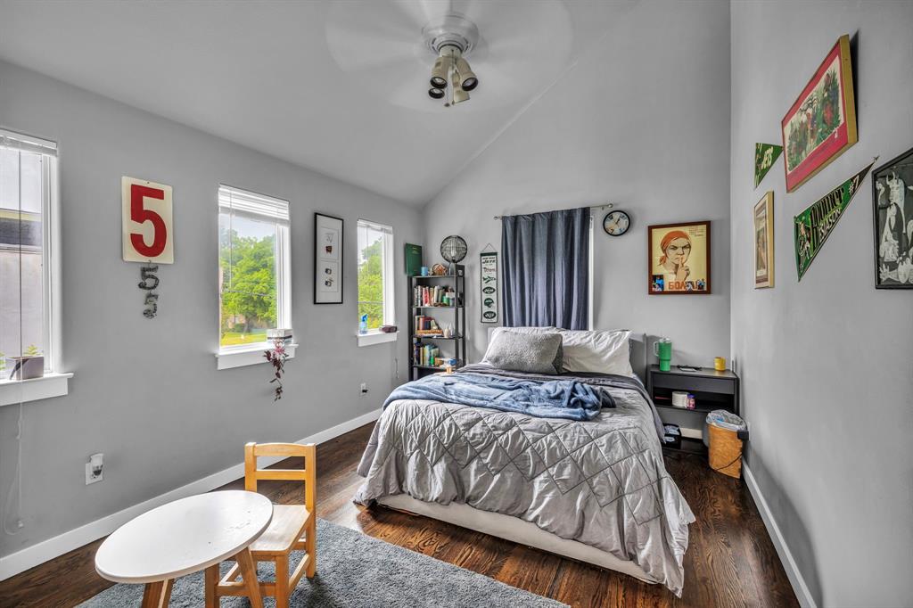 4517 Depew Avenue Austin, TX 78751 - Photo 12 of 20 a bedroom with a bed dresser and a window