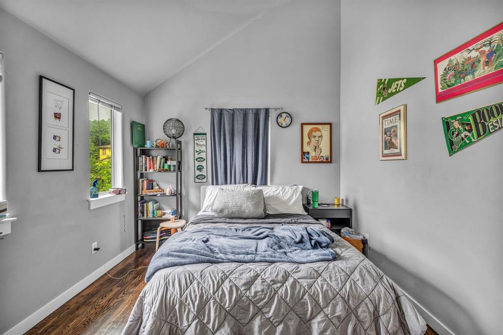 4517 Depew Avenue Austin, TX 78751 - Photo 13 of 20 a bedroom with a bed and painting on the wall