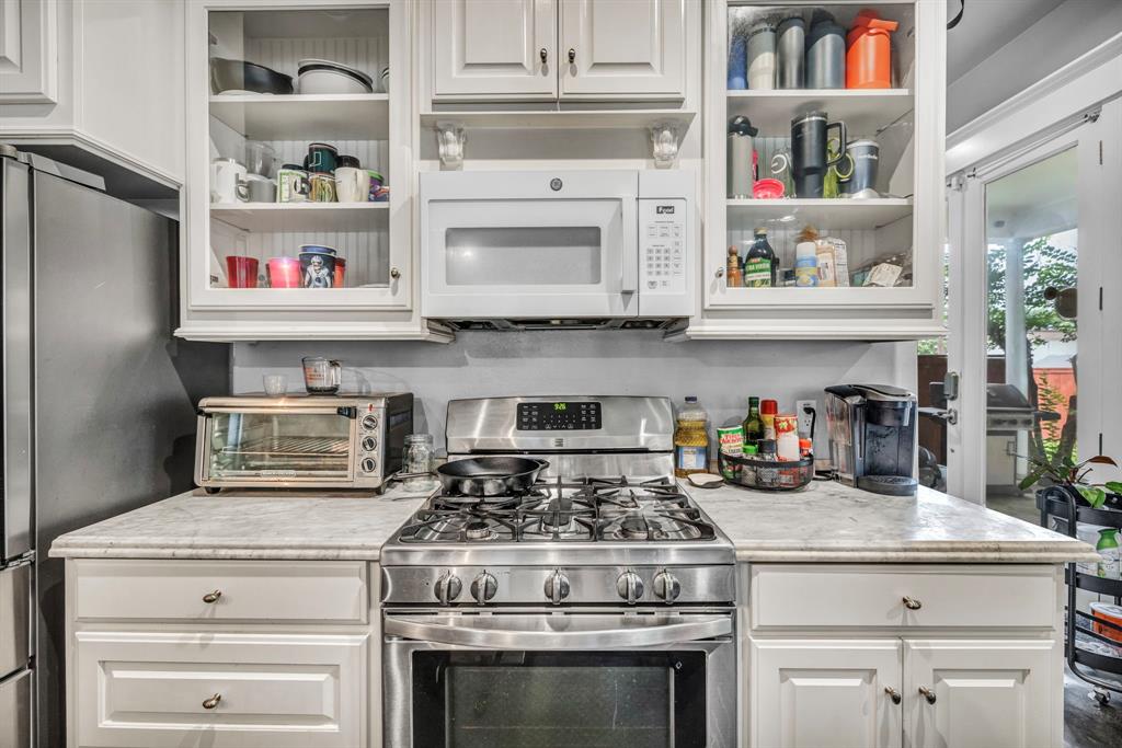 4517 Depew Avenue Austin, TX 78751 - Photo 5 of 20 a stove top oven sitting inside of a kitchen and stove
