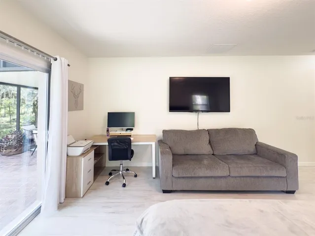 a bedroom with a bed and a lamp