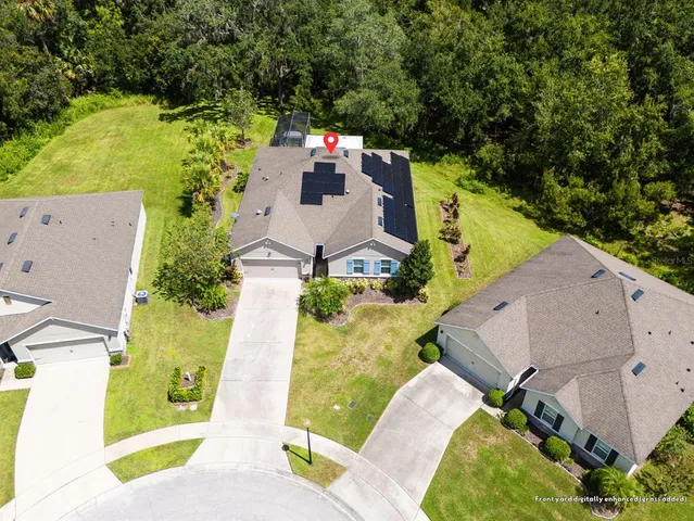an aerial view of residential house with outdoor space