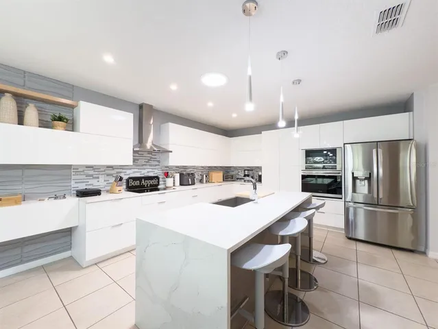a living room with furniture gym equipment and a large window