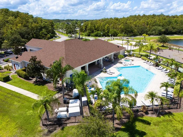 an aerial view of a house swimming pool and outdoor space