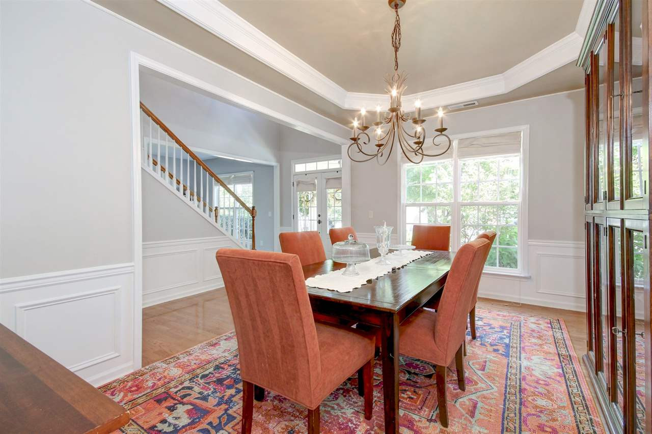 7532 Silver View Lane Raleigh, NC 27613 - Photo 4 of 30 Elegant dining room with ample natural lighting. Hardwoods floors , wainscoting and tray ceiling. Host a formal dinner party with friends and family or a casual buffet style dinner. Room for everyone! Dining Room