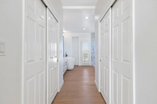 a view of a hallway with a white walls