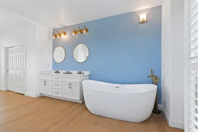 a bathroom with a bathtub and a sink