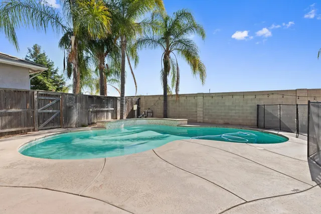 a swimming pool with outdoor seating