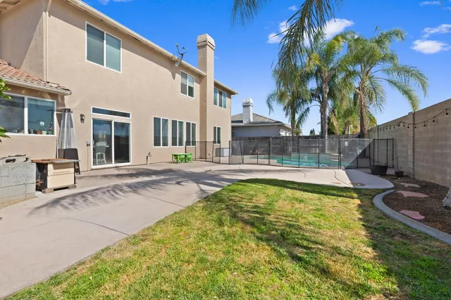 a view of a backyard with a patio