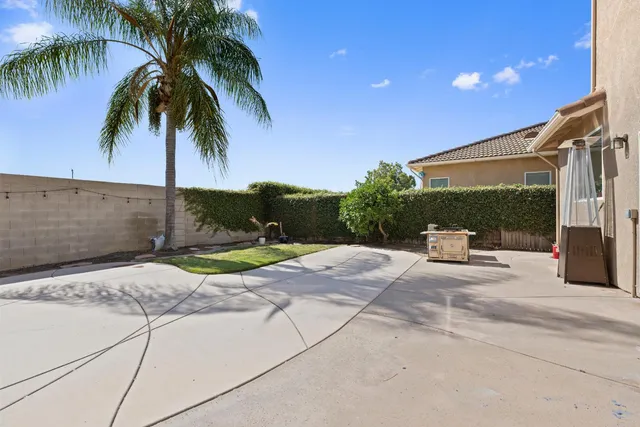 an aerial view of a house with a yard and lake view