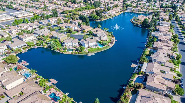 an aerial view of a house with a lake view