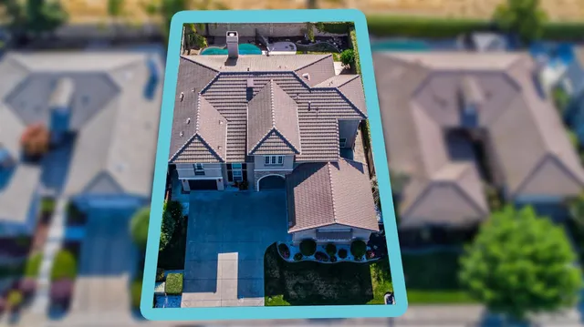 an aerial view of residential houses with outdoor space