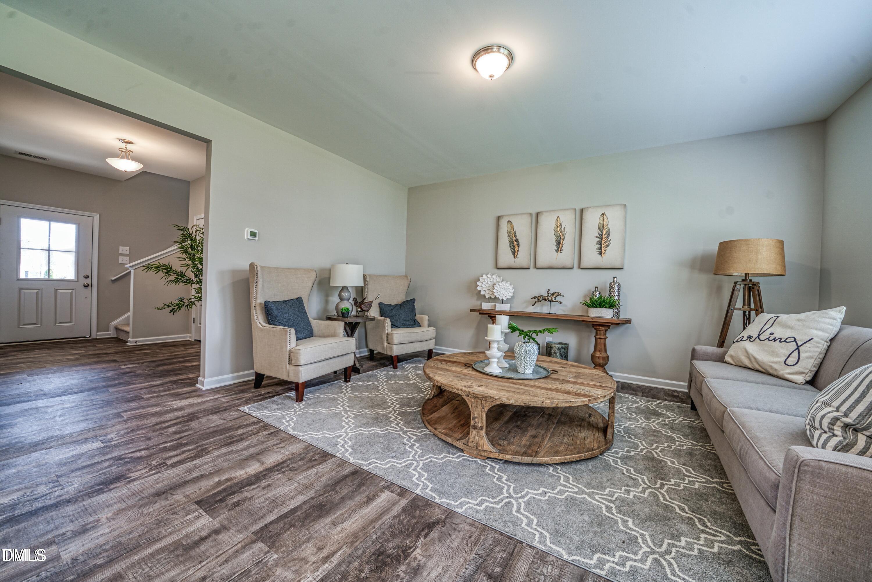 2304 Broad Street Durham, NC 27704 - Photo 18 of 39 a living room with furniture and a wooden floor