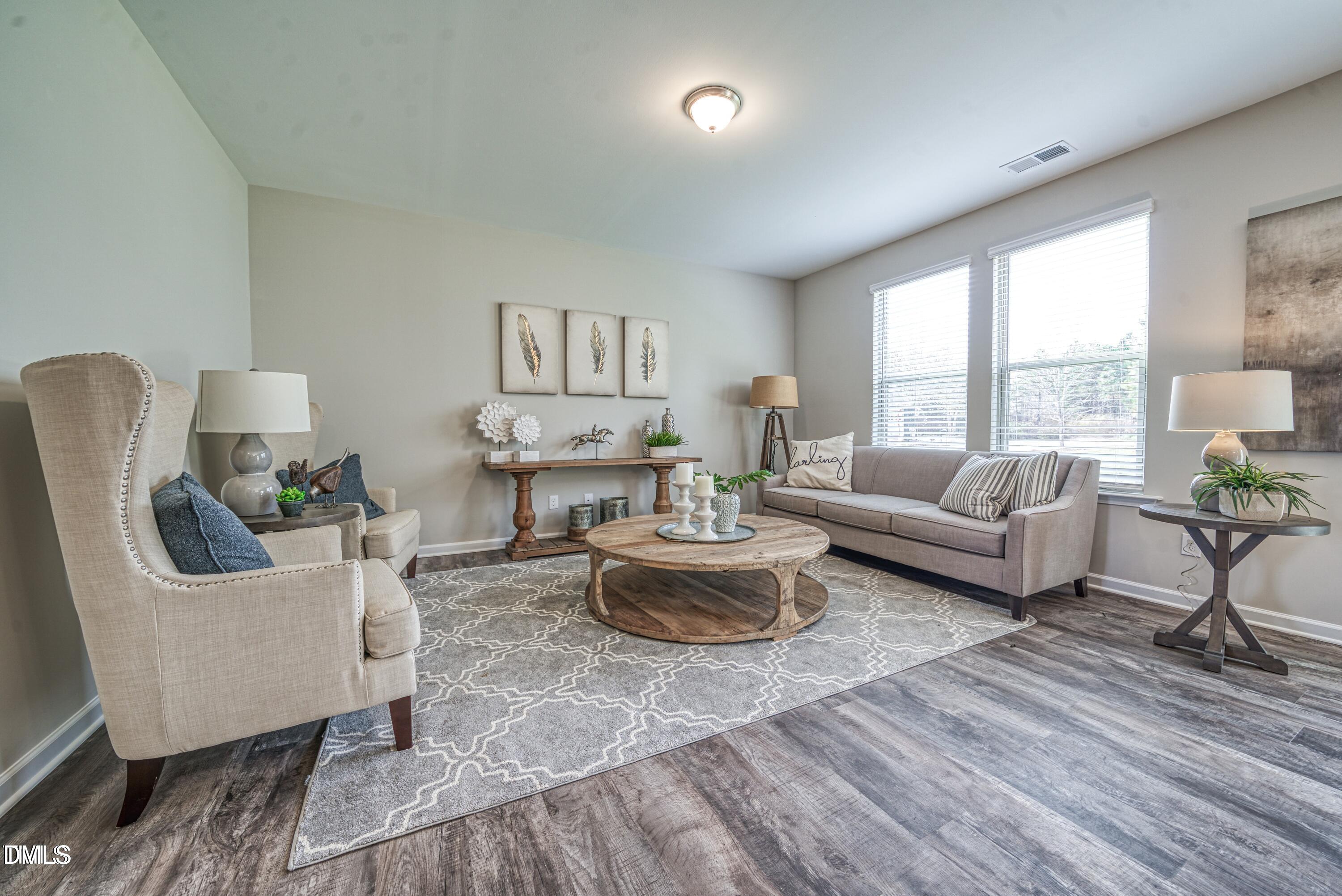 2304 Broad Street Durham, NC 27704 - Photo 19 of 39 a living room with furniture and a large window