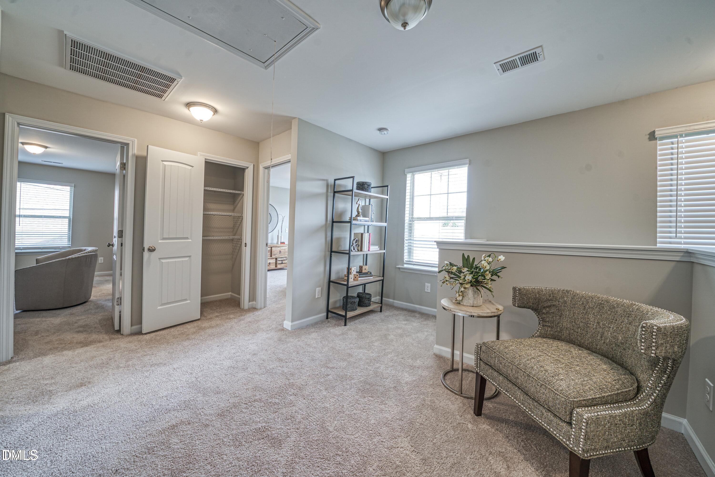2304 Broad Street Durham, NC 27704 - Photo 22 of 39 a living room with furniture and gym equipment