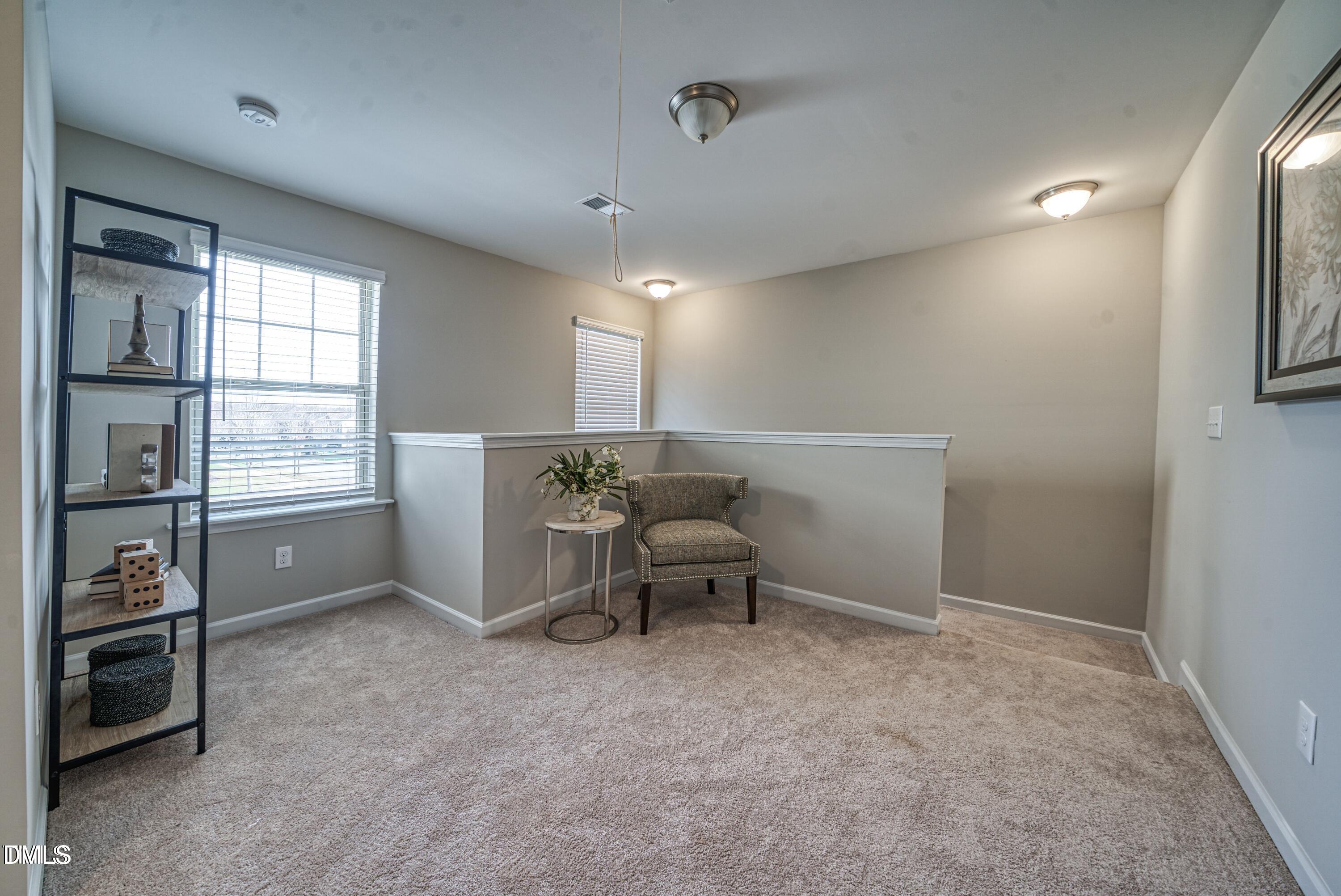 2304 Broad Street Durham, NC 27704 - Photo 23 of 39 a living room with furniture and a window