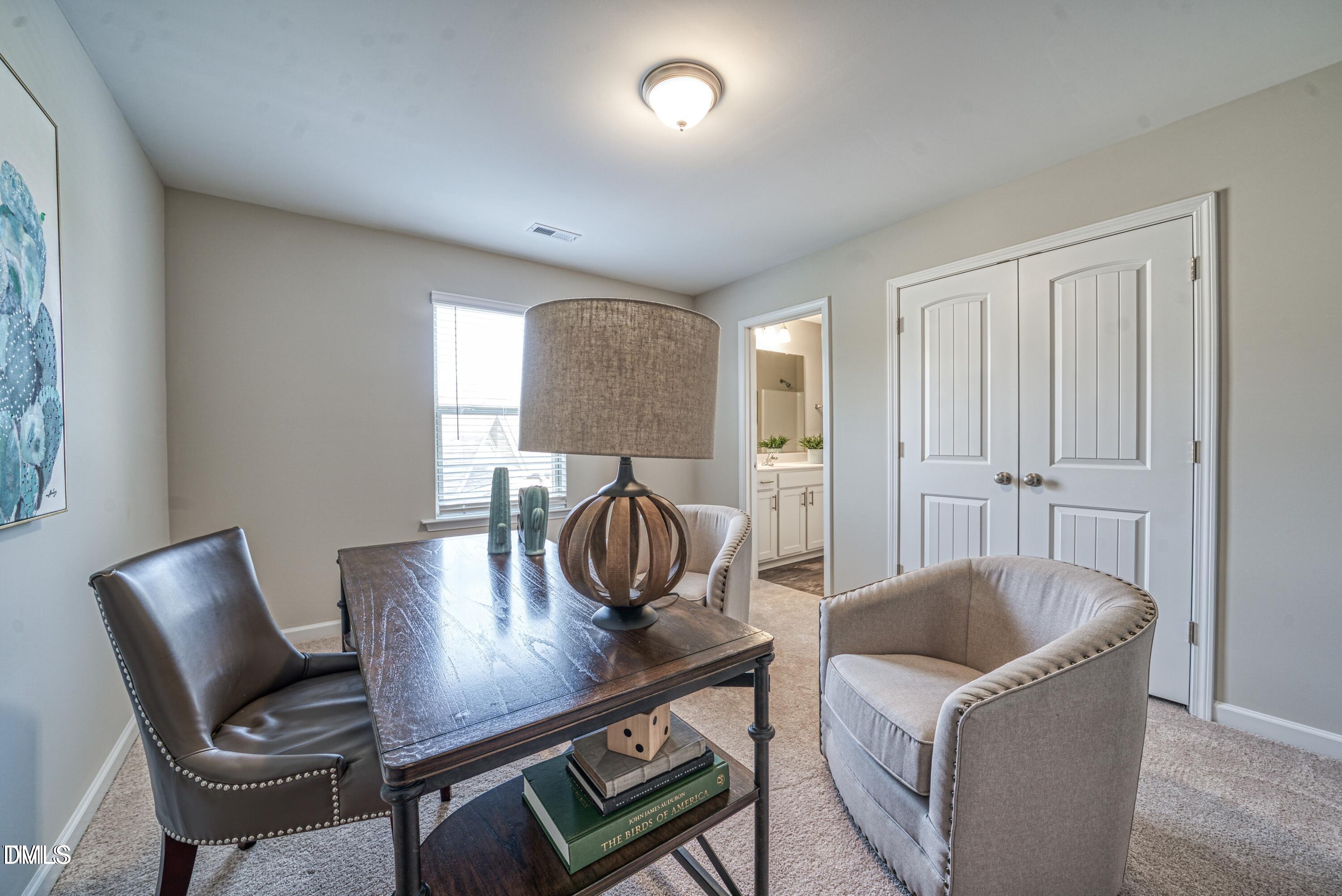 2304 Broad Street Durham, NC 27704 - Photo 25 of 39 a living room with furniture and a wooden floor