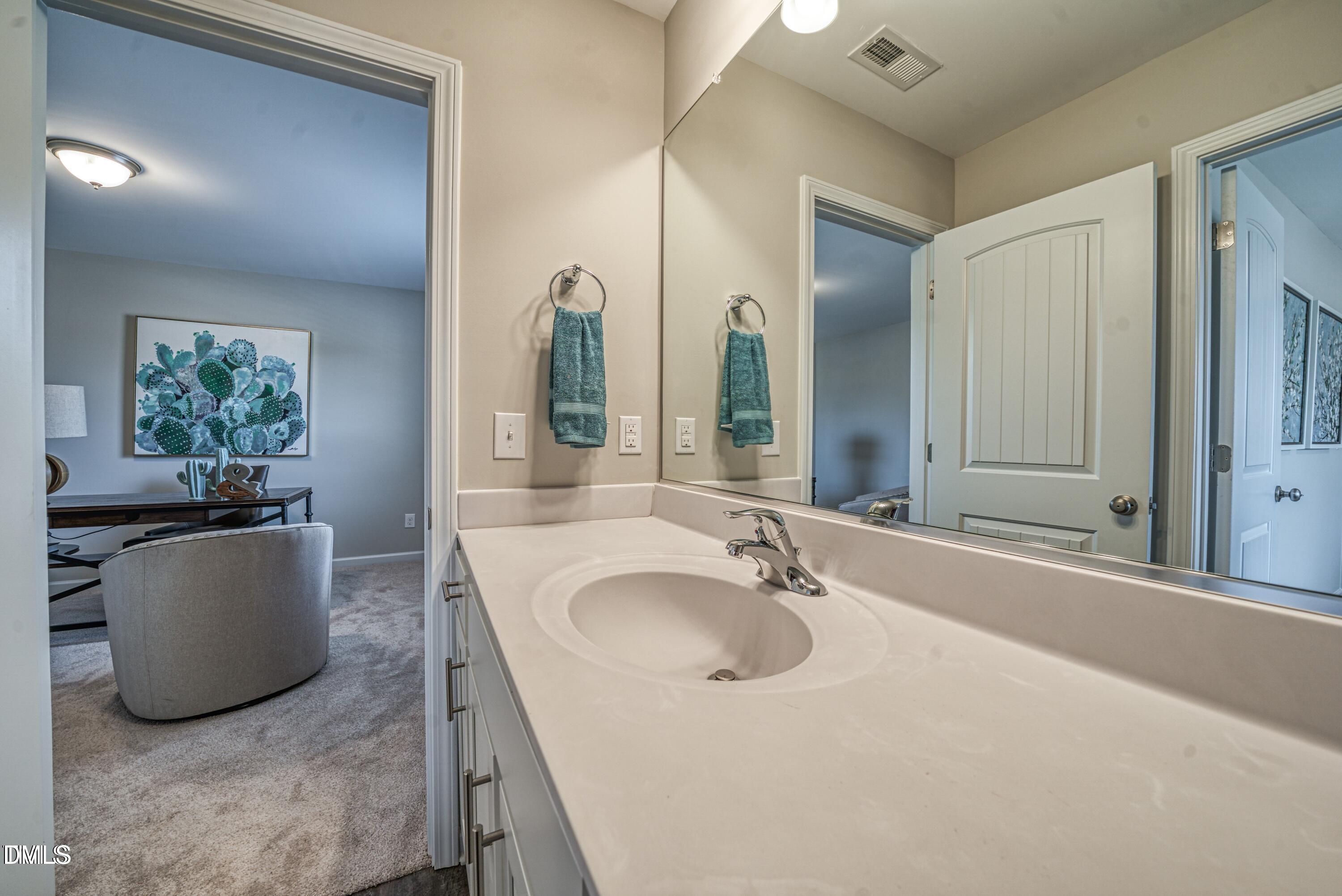 2304 Broad Street Durham, NC 27704 - Photo 28 of 39 a bathroom with a tub sink and mirror