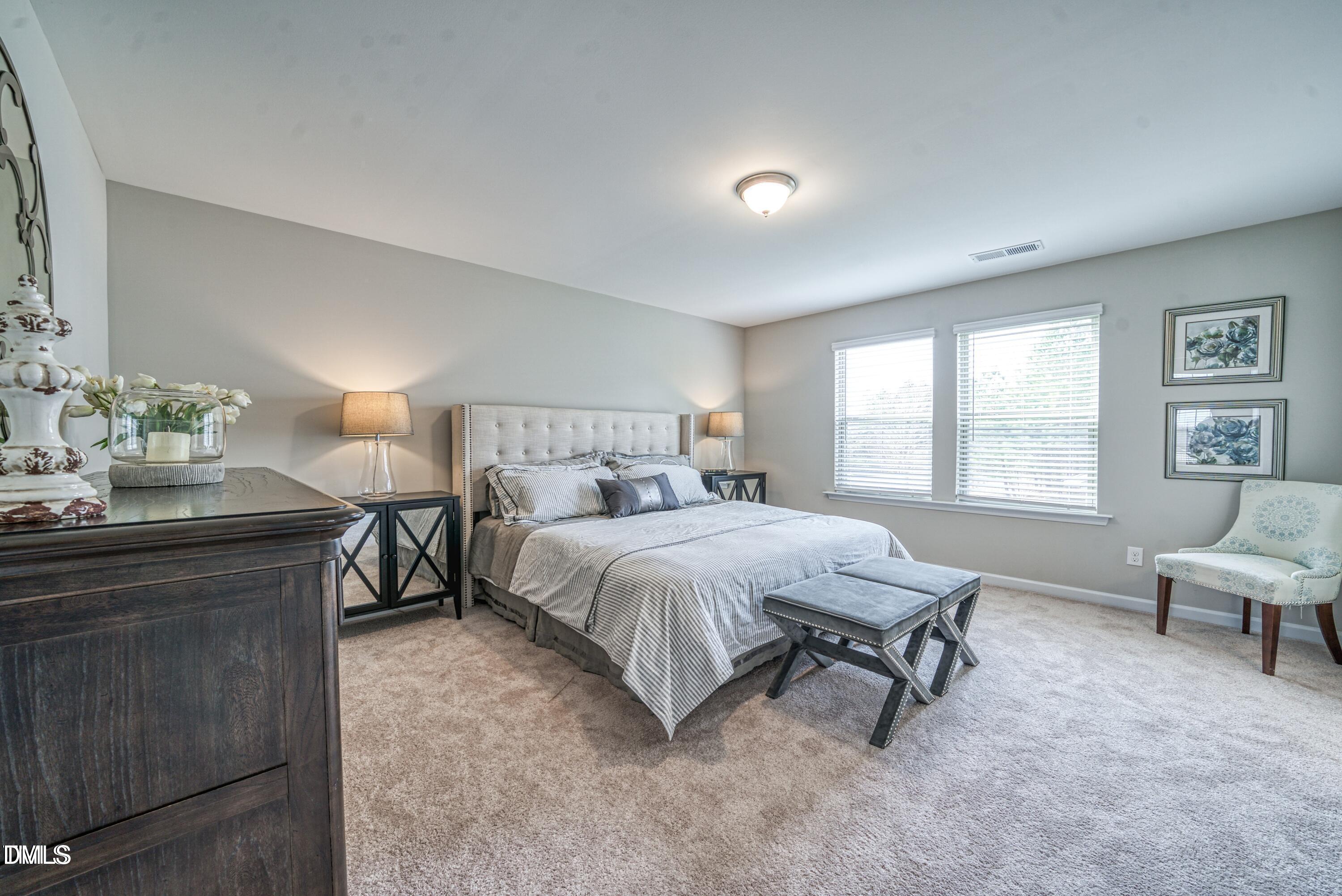 2304 Broad Street Durham, NC 27704 - Photo 36 of 39 a spacious bedroom with a bed and window
