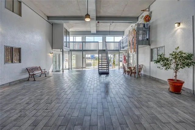 a lobby with furniture and floor to ceiling window