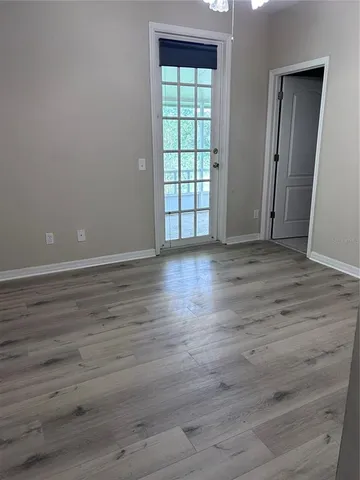 a view of an empty room with a window