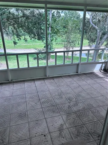a view of porch with a floor to ceiling window