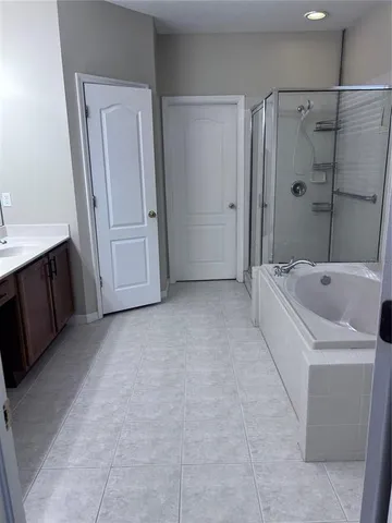 a bathroom with a sink double vanity and a mirror