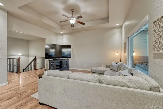 a view of a dining room with furniture and chandelier
