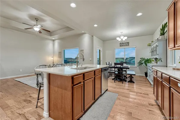 a kitchen with sink stove and cabinets