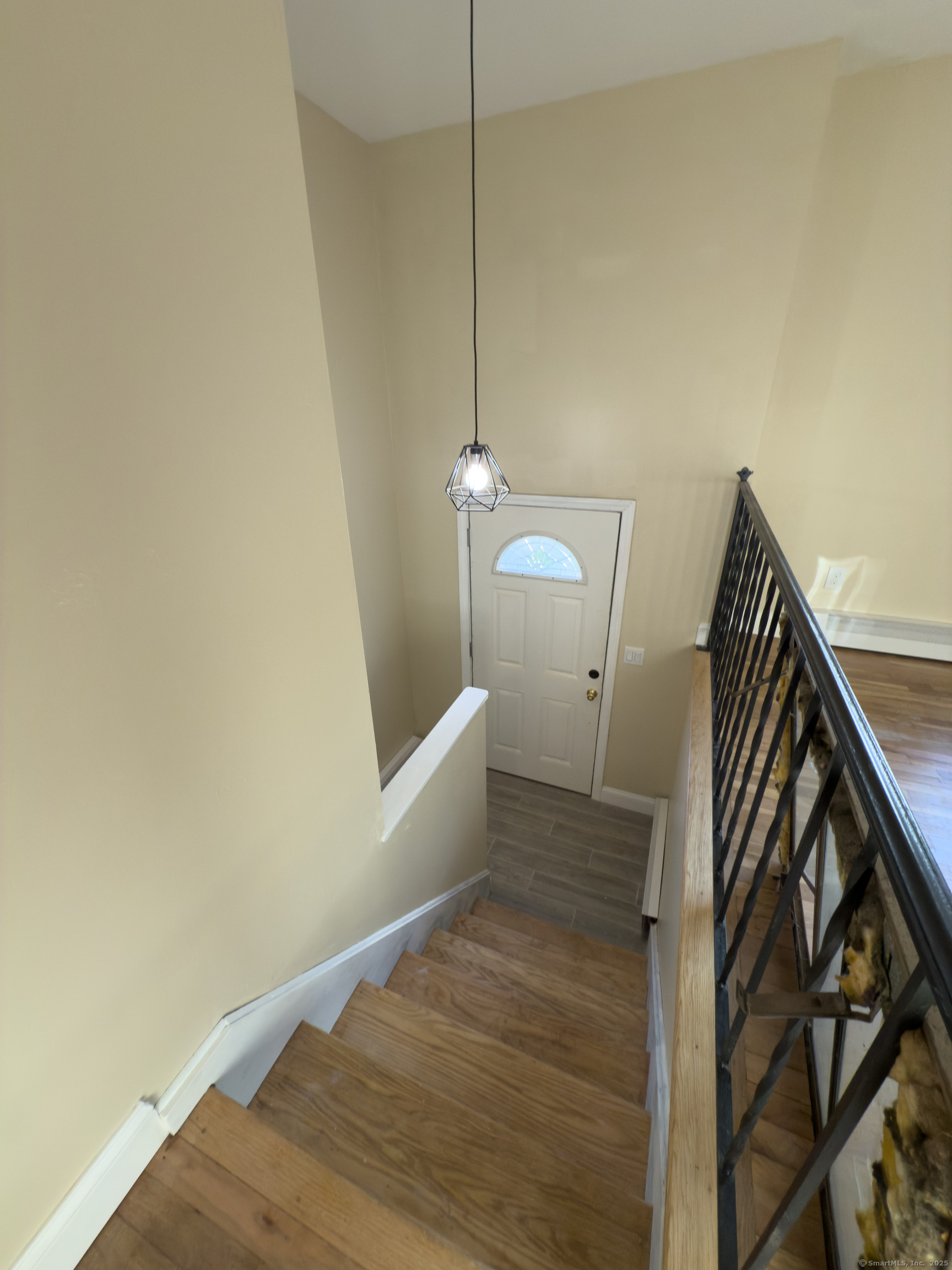 3 Fairview Drive Stonington, CT 06379 - Photo 12 of 20 a view of a room with wooden floor and staircase