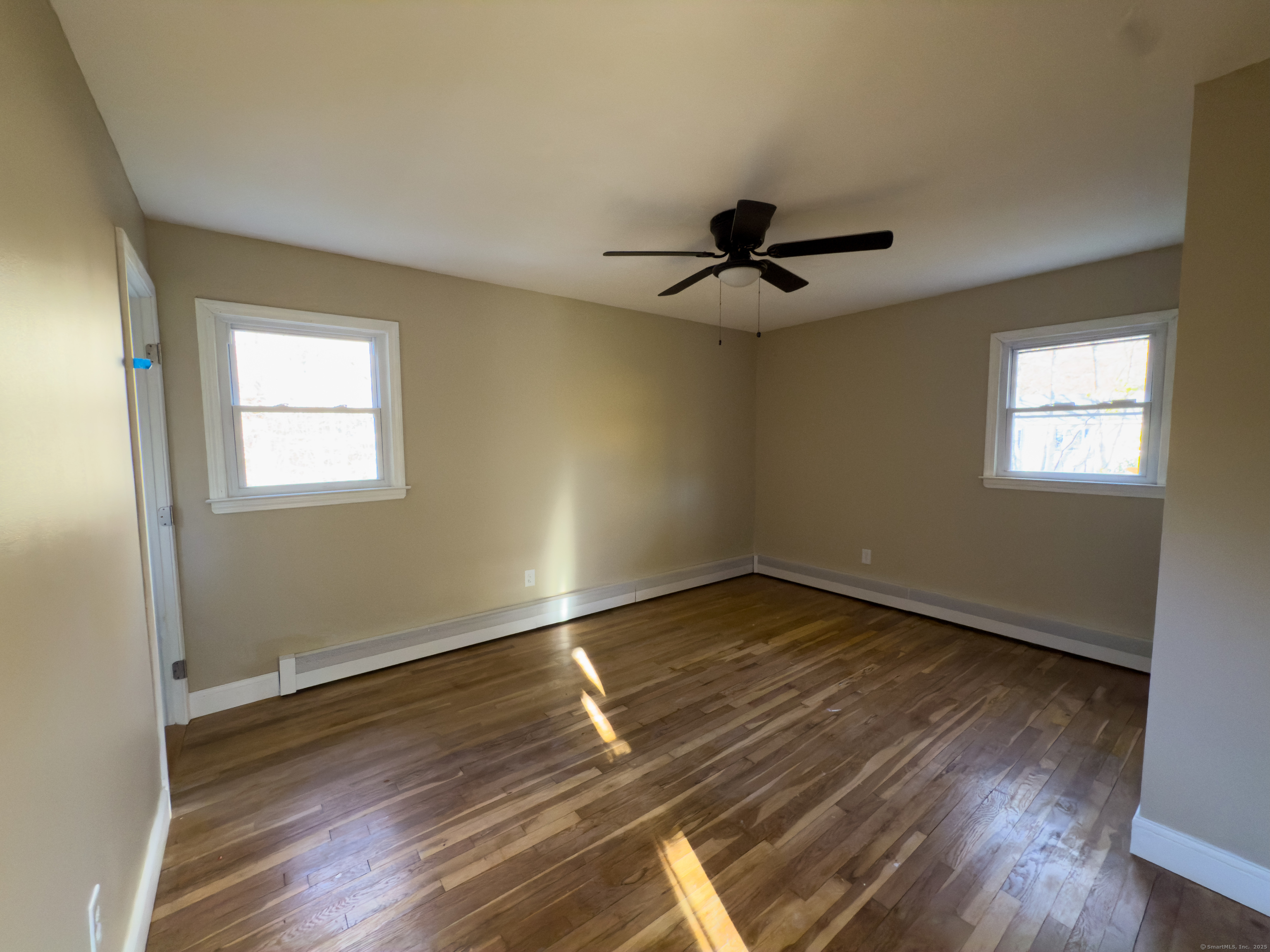 3 Fairview Drive Stonington, CT 06379 - Photo 14 of 20 a view of an empty room with wooden floor and a window
