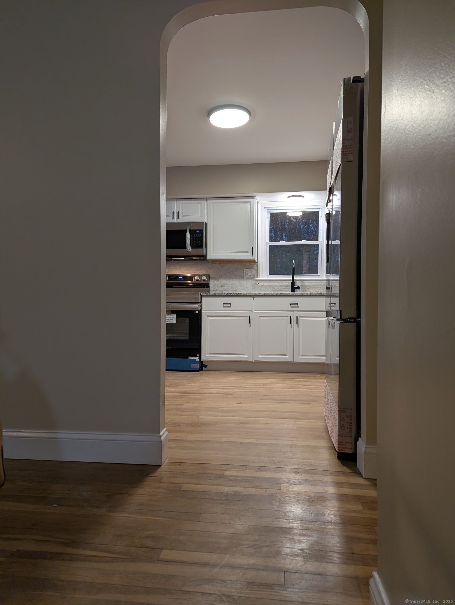 3 Fairview Drive Stonington, CT 06379 - Photo 6 of 20 a large kitchen with a sink and dishwasher a stove with wooden floor