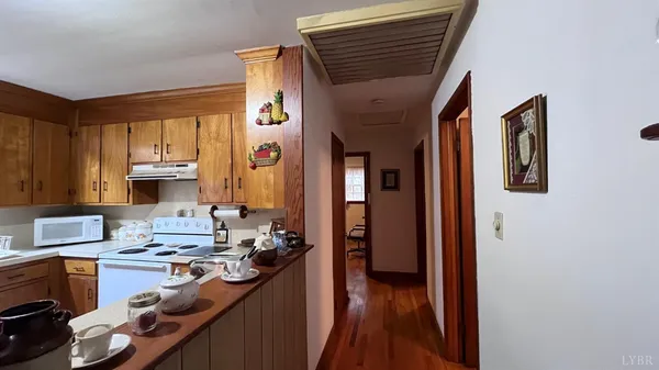 a dining room with furniture and a window